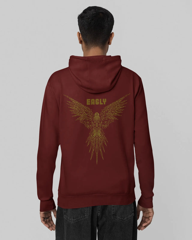 Person wearing a maroon hoodie with a gold eagle design on the back against a gray background