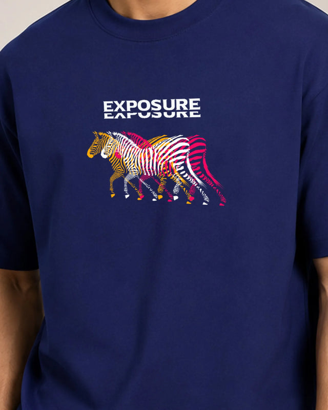 Navy blue t-shirt with colorful zebra design and 'Exposure' text on a plain background