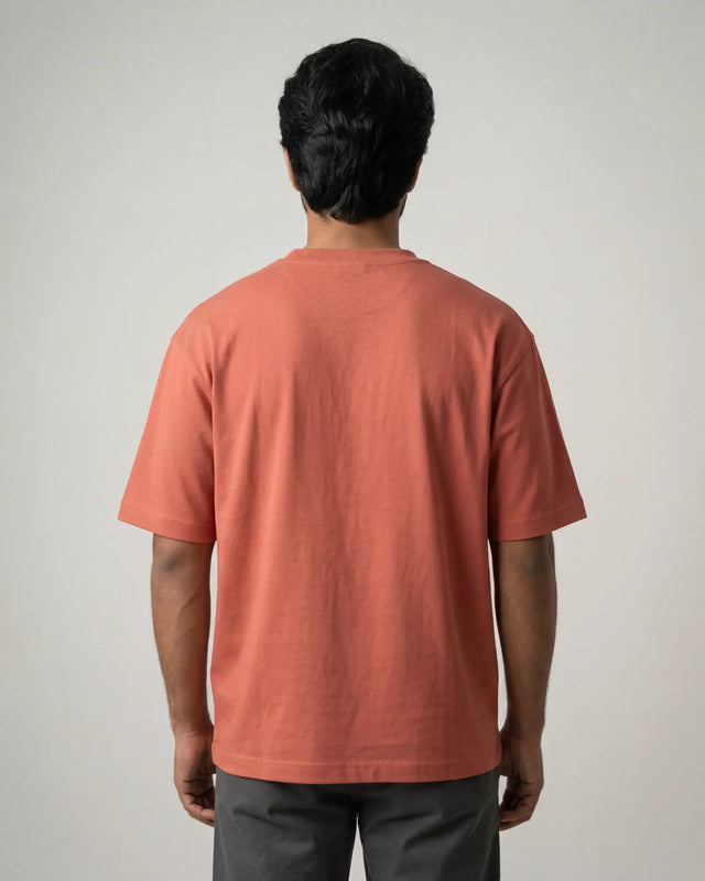 man wearing coral tshirt
