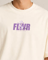off-whitet-shirt with purple 'FLWR' graphic design on a plain background
