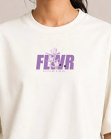 Off-White t-shirt with purple 'FLWR' logo on a plain background