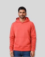 Man wearing a coral hoodie against a gray background