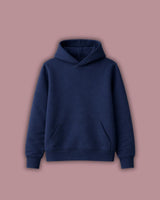 Navy blue hoodie on a pink background