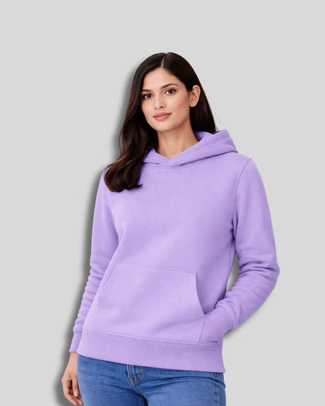 Woman wearing a lavender hoodie against a light gray background