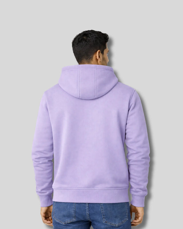 Person wearing a light purple hoodie from behind on a gray background